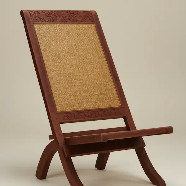 Maharaja hand-carved Anglo-Indian folding chair in mahogany with woven cane seat and back, luxury heritage furniture.