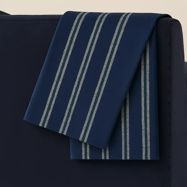 Close-up of woven stripe cotton blanket brushed finish fabric in navy with white stripes